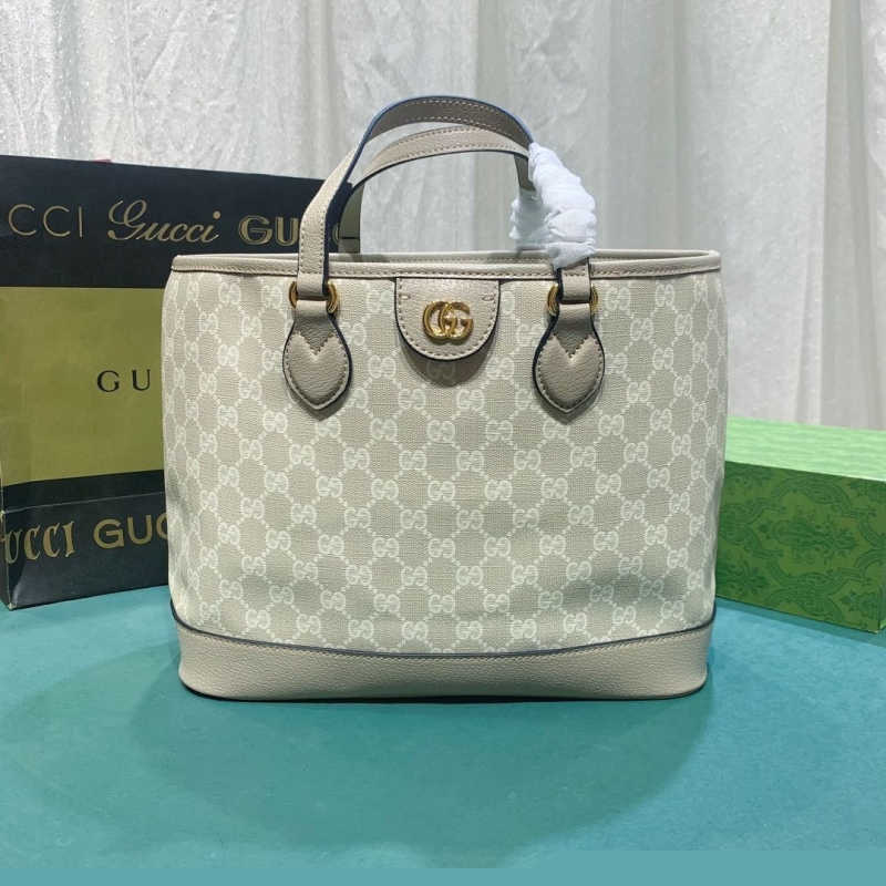 G*u*i shopping bags